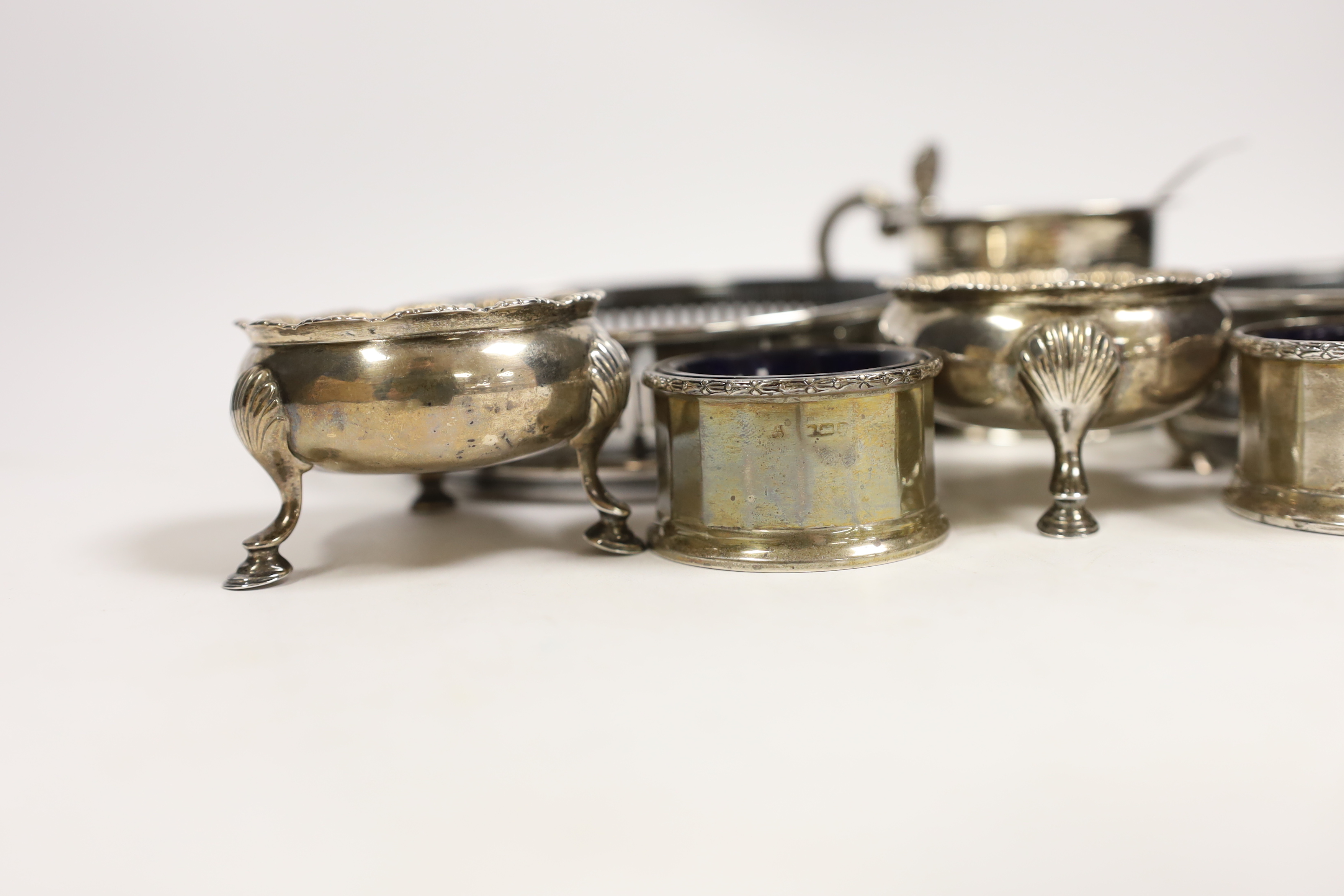 An early Victorian Scottish silver drum mustard, Edinburgh, 1844?, 7cm, two pairs of silver salts including pair by David & Robert Hennell, London, 1766 and a pair of silver plated wine coasters.